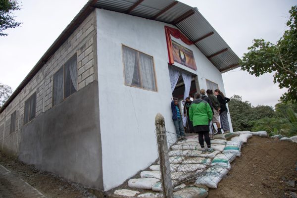 Congregation entering a newly built village church in Mexico