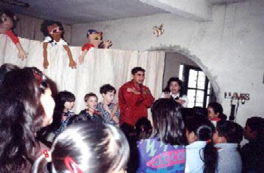 Family mission trip participants with local children